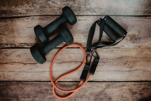 Gym equipment including dumbbells and skipping rope