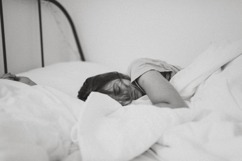 Black and white photo of person sleeping