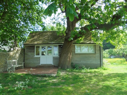 A lodge behind a tree 
