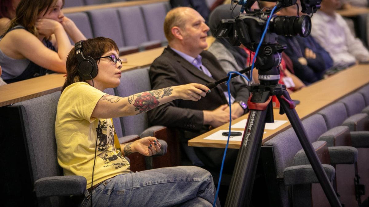 A picture of a Leeds Trinity University Film student operating a camera