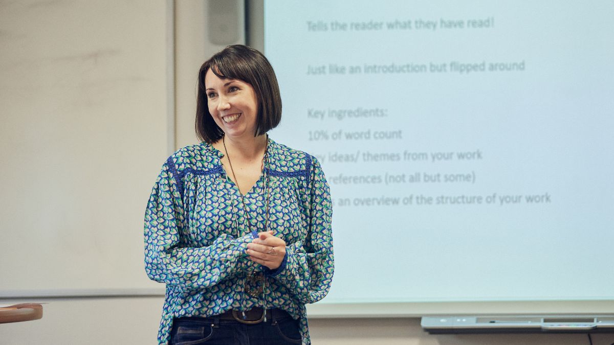 A picture of a lecturer smiling