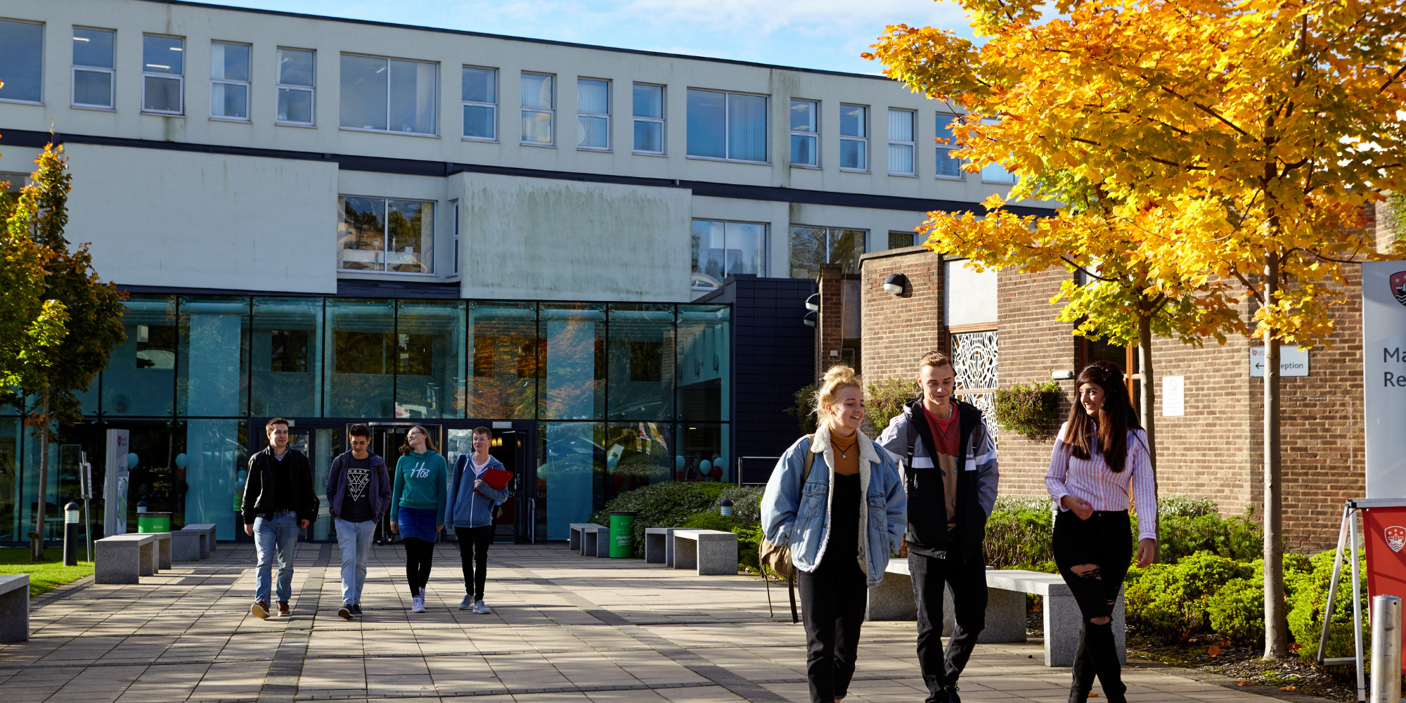 Students walking around university building